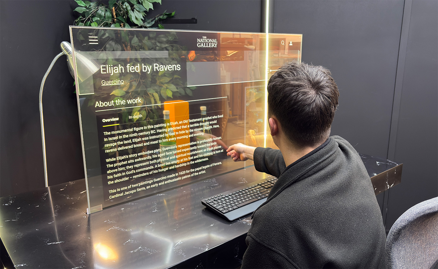 Designer Transparent Touch Screen Table displaying National Gallery website, operated by touch